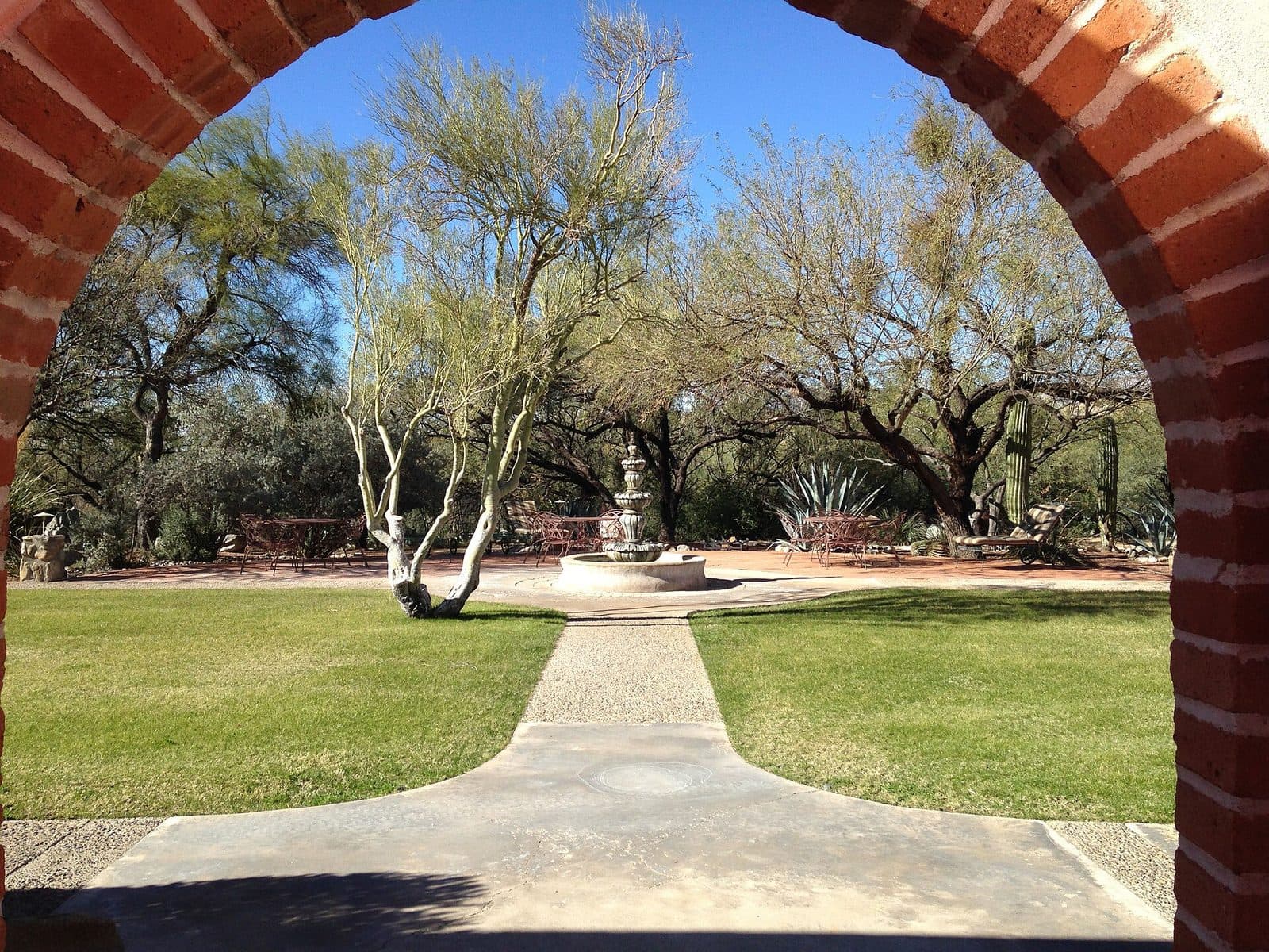 Adobe arch framing a desert garden at Tanque Verde, AZ