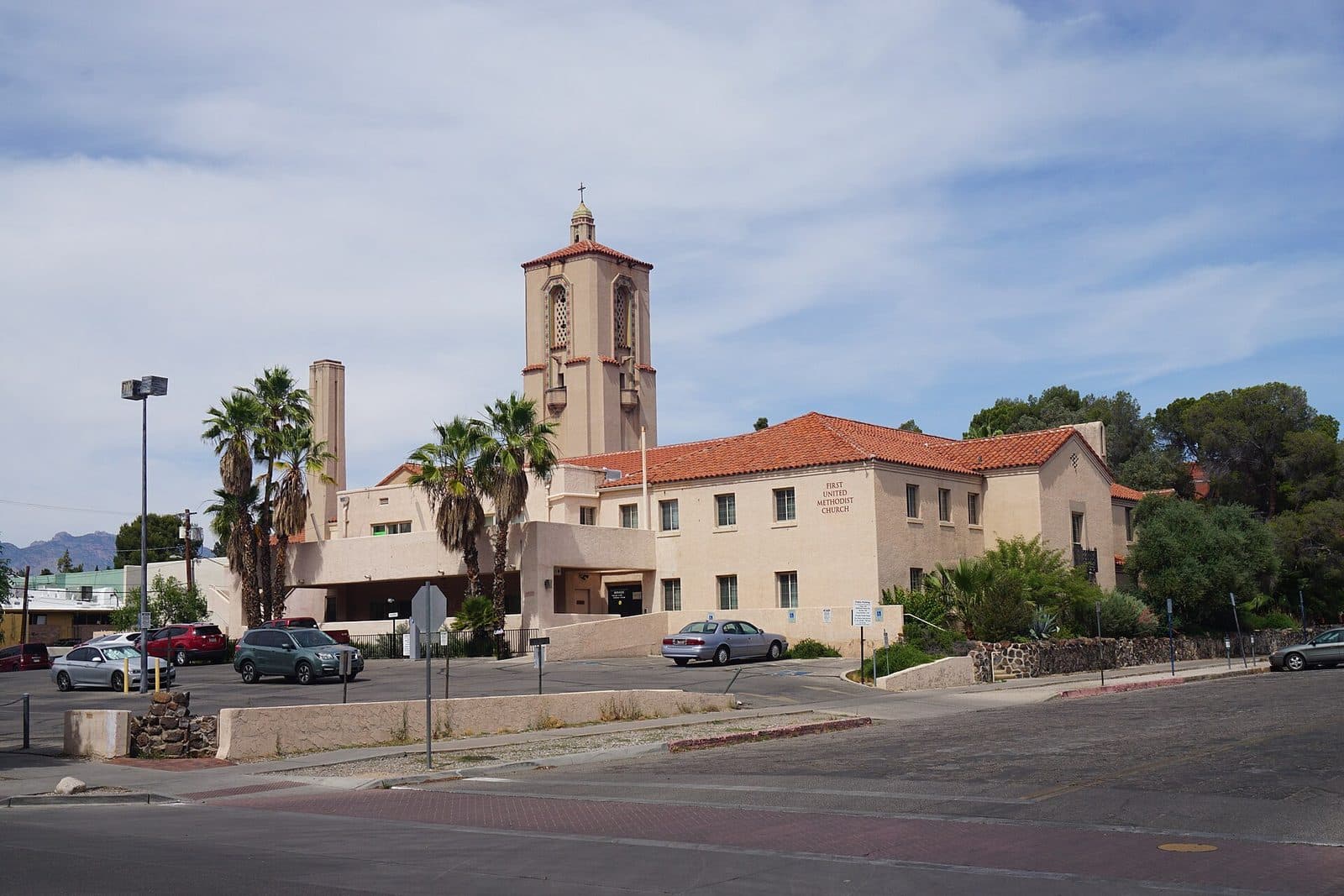 Palm trees and a mission-style church in central Tucson, AZ